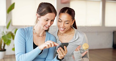 Buy stock photo Phone, pilates and reading with friends in studio for social media, workout post and comment. Online yoga discussion, communication app and chat with women in class for wellness, health and support