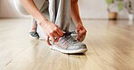 Person, hands and tie with shoes for workout preparation, start exercise or indoor training. Closeup, active or tying laces with sneakers or getting ready for fitness, run or gym in health club