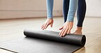 Yoga mat, meditation and woman in studio, hands and rolling with wellness, start and calm. Closeup, yogi and healthy person with routine and equipment with stress relief, inner peace and workout