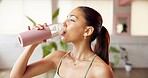 Fitness, drinking water and woman in studio, indoor exercise and hydration on workout break. Thirsty, refreshing liquid and person gulp from bottle for recovery, yoga pause and rest in health club.
