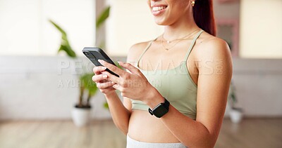 Buy stock photo Phone, smile and hands of woman in yoga class typing for communication with online app. Fitness, gym and female person with technology for networking, contact and social media in pilates studio