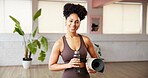 Portrait, fitness and woman in studio, water bottle and smile with wellness, yoga mat and exercise. Happiness, liquid and healthy person in gym, confidence and aqua with hydration or pilates training