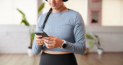 Buy stock photo Phone, hands and woman at pilates class with networking, communication or social media on mobile app. Technology, fitness and person at yoga session with cellphone for texting, research or chatting.