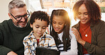 Tablet, relax and parents with kids on sofa in home for watching movie, series or show. Happy, digital technology and children with mother and father for streaming film together in living room.