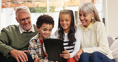 Buy stock photo Tablet, relax and grandparents with kids on sofa in home for watching movie, series or show. Happy, digital technology and senior people with children for streaming film together in living room.