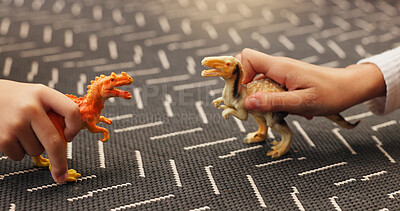Buy stock photo Dinosaurs, toys and hands of children in home for playing, bonding or friendship together. Reptiles, connection and kid siblings with animal game for growth, development or entertainment in house.