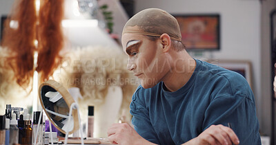Buy stock photo Drag artist, mirror and makeup for beauty, thinking and makeover in dressing room. LGBTQ performer, person and cosmetics backstage for preparation, transformation results or reflection with aesthetic