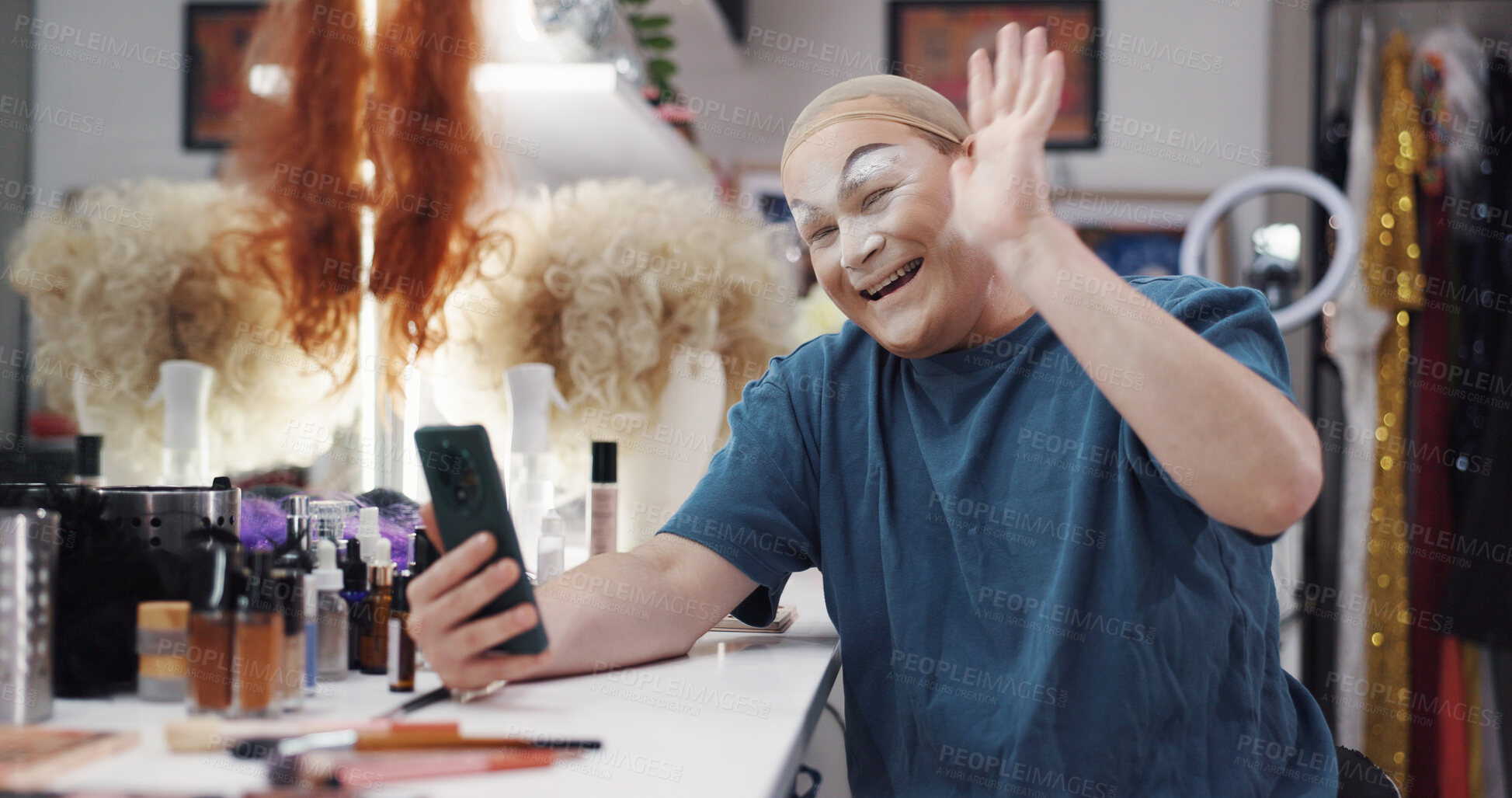 Buy stock photo Person, video call and drag artist in dressing room with smile for performance, cabaret or show. Talent, beauty and lgbt performer at club for cosmetics, wave hello and mobile app for chat at theater