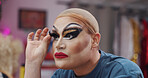 Person, lashes and drag artist in dressing room with application for production, cabaret or show. Talent, beauty and lgbt performer at club for cosmetics, eye makeup or prepare for concert at theater