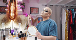 Person, spray face and drag artist in dressing room with application for production, cabaret or show. Talent, beauty and lgbt performer at club for cosmetics, ready and bottle for concert at theater