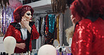 Drag performer, cosmetics or person in dressing room for getting ready, show preparation or set wig. Stage makeup, transformation or artist with fashion for performance, queer culture or backstage