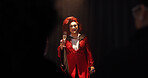 Person, drag artist and stage for portrait at theater with toast, celebration and pride at event. Lgbt performer, champagne and smile with audience, thanks and makeup with microphone at cabaret show