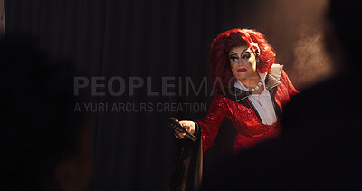 Buy stock photo Person, drag artist and mic on stage for performance, hosting show and audience engagement. Performer, spotlight and space for live entertainment, theater event and unique character for interaction