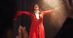 Person, drag artist and stage with applause, praise and excited with thanks for crowd at cabaret show. Lgbt performer, musician or singer with gratitude, happy and pride with celebration in audience