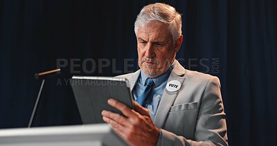 Buy stock photo Podium, politician and man on tablet for speech notes, election debate and prepare on stage. Government, candidate and mature person on digital tech for political agenda, voting stats and planning