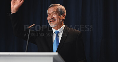 Buy stock photo Wave, Asian man and politician on stage for election, democracy or political campaign. Speech, greeting and mature speaker at conference, meeting or seminar event for vote or activism at convention