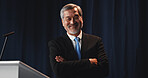 Mature man, portrait and confident politician at podium for election campaign event, pride or happy. Smile, politics and Asian person as government speaker, arms folded or presidential candidate