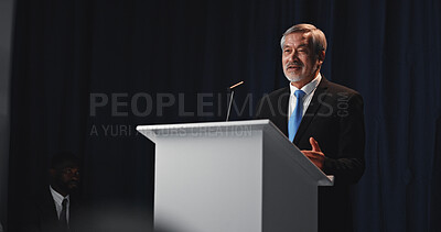 Buy stock photo Podium, mature man and politician with mic for election, democracy or political campaign. Speech, greeting and guest speaker at conference, meeting or seminar event for vote or activism at convention