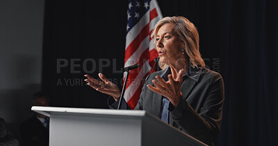 Buy stock photo Politician, speech and woman with American flag by podium for election, debate and voting campaign. Government, candidate and mature person on stage for press conference, political policy and rally