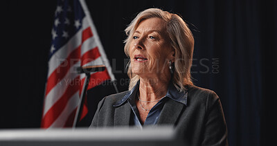 Buy stock photo Politician, speaker and woman with American flag by podium for election, debate or voting campaign. Government, candidate and mature person on stage for press conference, political policy and speech