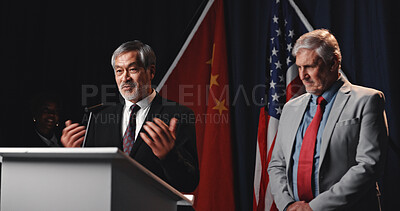 Buy stock photo Election, politicians and men on podium for speech with mic for democratic selection at debate. Campaign, discussion and male candidates with press conference for votes on stage for public relations.