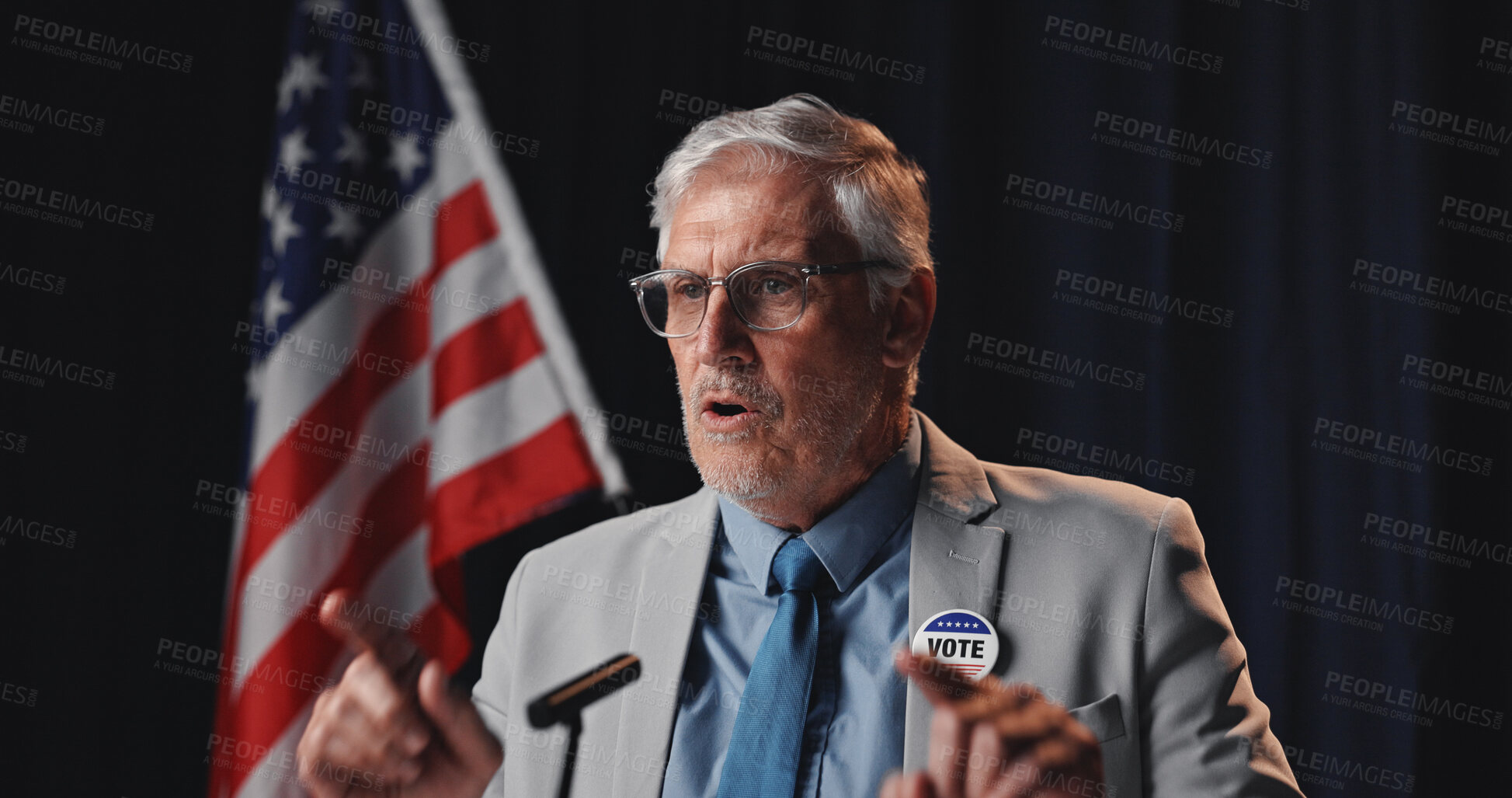 Buy stock photo Mature man, speaker and vote with american flag for global economic change, politics or opportunity. Male person, diplomat or politician with mic for public relations or national election in USA