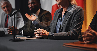 Buy stock photo Hands, panel and flags at international conference for geopolitics, presentation or announcement. Person, speaker and ambassador with group, politician or global leader in trade negotiation at event