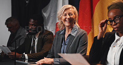 Buy stock photo Summit, politics or happy woman with group, delegation or international government panel. Press conference, people or portrait of mature politician at event for diplomacy, global forum or policy expo