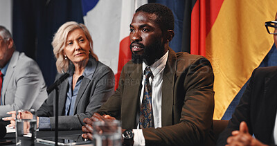 Buy stock photo Politics, event and man with speech at press conference for campaign update, delegation or feedback. Discussion, government panel and politician at summit for global inequality or COP30 preparation
