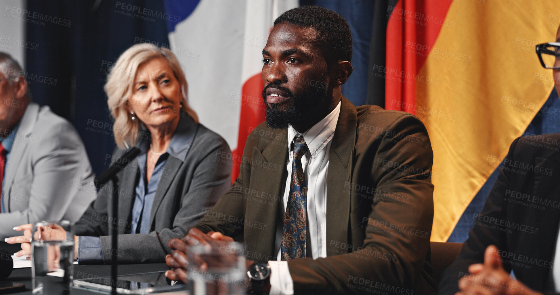 Buy stock photo Politics, event and man with speech at press conference for campaign update, delegation or feedback. Discussion, government panel and politician at summit for global inequality or COP30 preparation