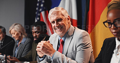 Buy stock photo Press conference, politics and happy man with government panel or international delegation. Summit, people and portrait of mature politician with group for diplomacy, global forum or policy expo