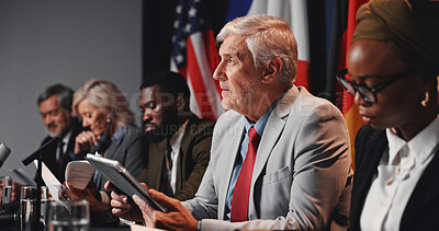 Buy stock photo Press conference, tablet and man with group for delegation, international government and panel. Summit, people and politician at speech event for diplomacy discussion, global forum or policy update