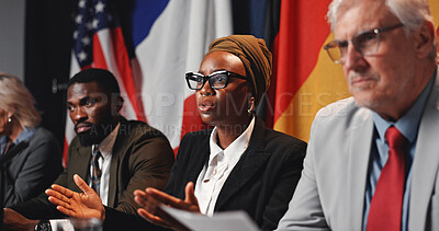 Buy stock photo Politics, team and woman with speech at press conference for campaign update, delegation or feedback. Global forum, government panel and speaker with discussion for policy decision or media relations