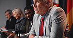 Press conference, speech and man with group for delegation, international government and panel. Summit, people and politician at seminar event for diplomacy discussion, global forum or policy update