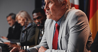 Buy stock photo Press conference, speech and man with group for delegation, international government and panel. Summit, people and mature politician at seminar event for diplomacy discussion, global forum or policy