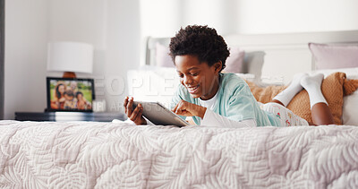 Buy stock photo Relax, smile and kid with tablet in bedroom for game, streaming show and learning online in home. African boy, bed and happy with digital technology for movie app, cartoon or reading ebook on weekend