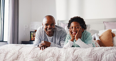 Buy stock photo Portrait, father and happy child relax on bed for care, bonding together and laugh in morning. African family, boy and dad in bedroom with smile, funny joke or development with single parent in home
