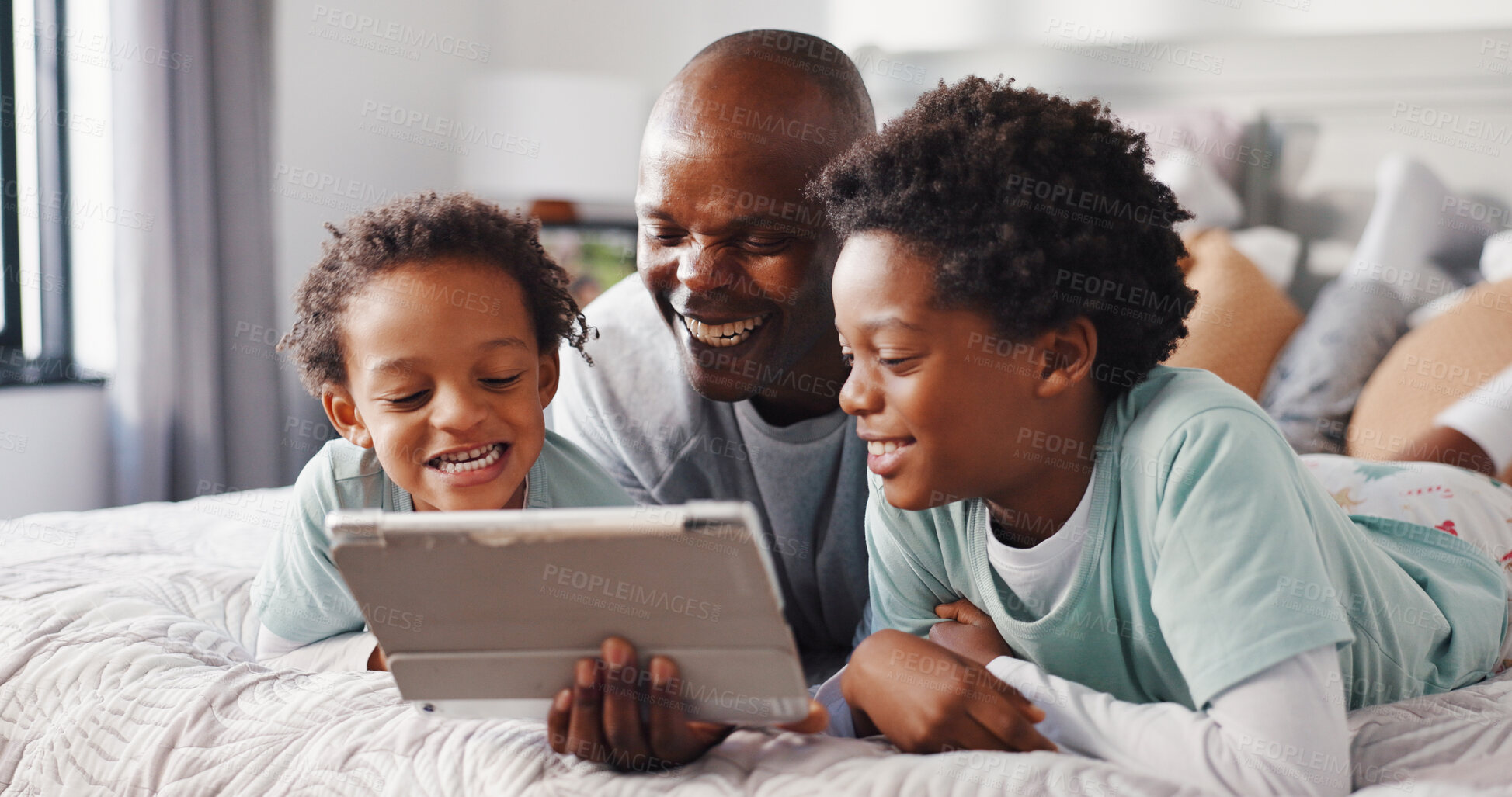 Buy stock photo Tablet, relax and father with children on bed in home for watching movie, series or show together. Happy, bonding and African dad with kids for streaming film on technology in bedroom at house.