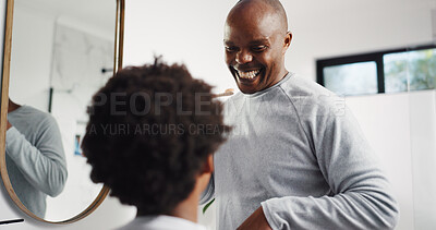 Buy stock photo Teaching, brushing teeth and dad with child in bathroom in home for dental care, hygiene or wellness. Learning, oral health and African father with boy kid for mouth routine in morning together.