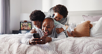 Buy stock photo Children, laugh and dad with smartphone, bedroom and watching cartoons with subscription or playing. Kids, happy and black man with mobile for movies, game and streaming videos on website in home