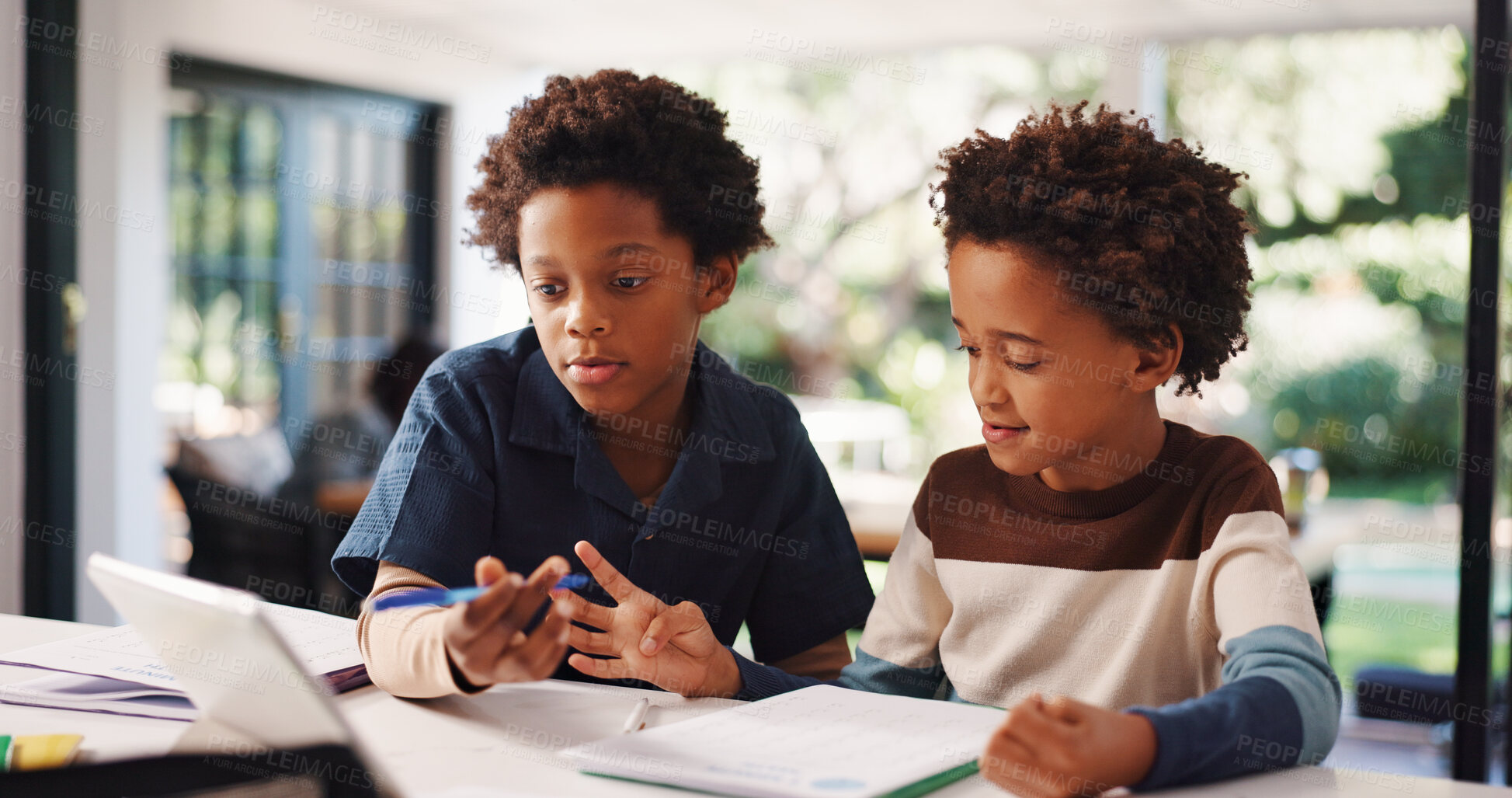 Buy stock photo Book, homework and children in house with education, learning or studying for test together. Writing, help and boy kids with knowledge for school assignment, assessment or exam by desk in apartment.