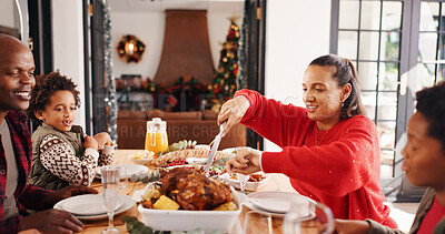 Buy stock photo Christmas, parents and kids with serving chicken in home for  festive feast, holiday celebration or eating. Food, african family or cut meat at dinner table for xmas tradition, brunch meal or bonding