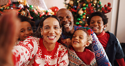 Buy stock photo Christmas, portrait and selfie of family, home and bonding on December holiday, excited and together. Interracial, man and woman with children on Xmas, celebration and photography for festive season