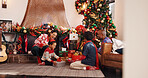 Excited, black family and kids with gift on Christmas, holiday celebration and bonding together. Smile, parents and children with giving present, xmas tradition and festive season in lounge at house