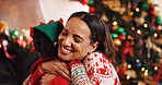 Happy mother, hug and child with love for christmas celebration, holiday or new year together in home. People, mom and kid with smile, embrace or care for festive weekend, family or bonding in house
