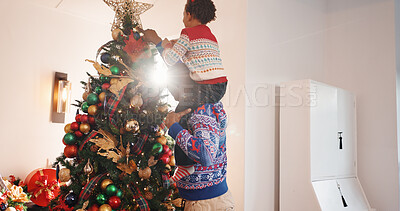 Buy stock photo Christmas tree, ornament and father with child in home for holiday, festive tradition and bonding. Family, love and happy dad with boy, bauble and celebration for December and xmas decoration