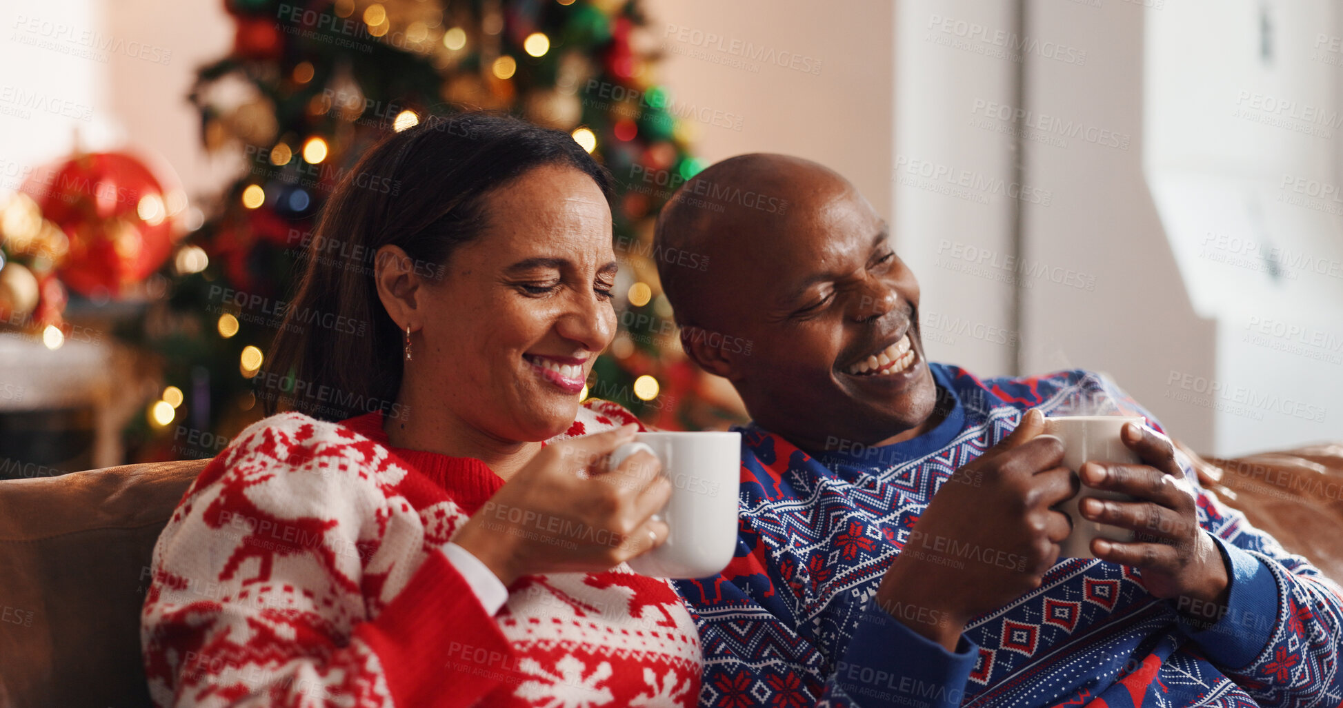 Buy stock photo Coffee, christmas and couple on sofa in home with bonding, connection or marriage in living room. Happy, love and man with woman for drinking eggnog for festive weekend with xmas tradition in house.