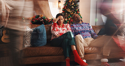 Buy stock photo Christmas, home and couple with stress, tired and exhausted with burnout, speed and headache. Xmas, man and woman on couch, tradition and tension with pressure, festive season and relationship