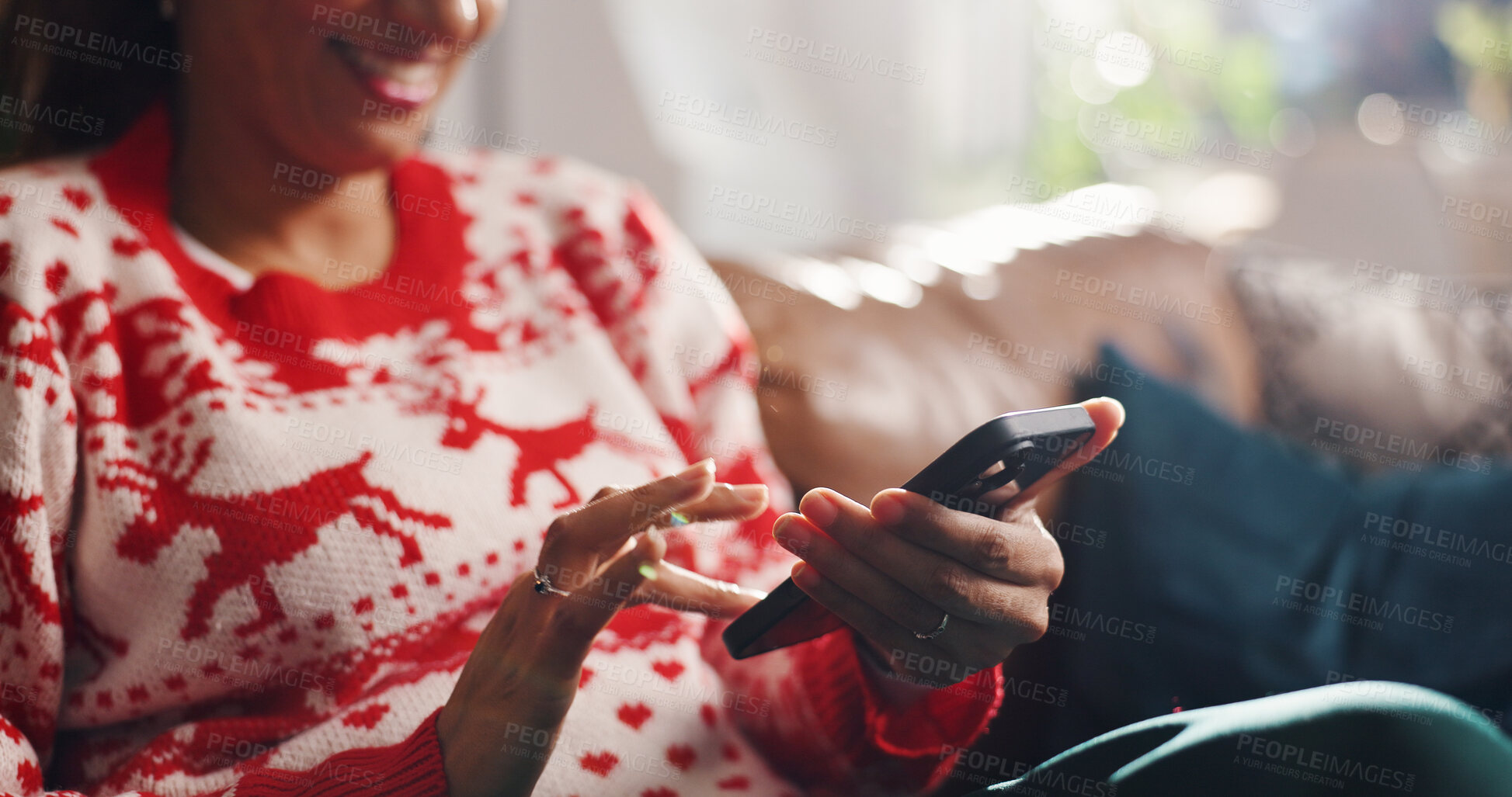 Buy stock photo Christmas, home and woman on sofa with phone, online shopping and festive smile in lounge. Xmas, person and vacation on couch with tech, holiday season and internet sale or deal with website info
