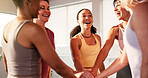 Women, hands stack and celebration at gym, fitness and circle with motivation, smile and wellness at club. People, excited and group for achievement, goals or success for training at exercise class
